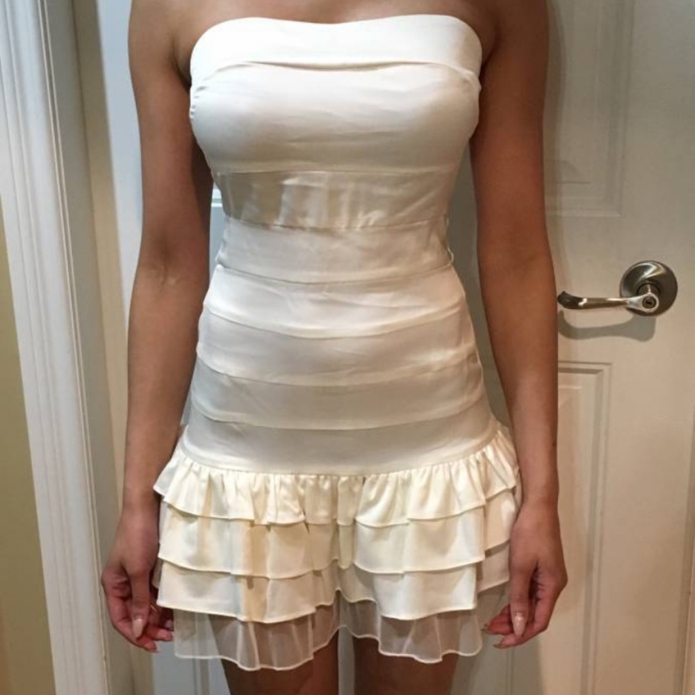 Cream strapless ruffle mini dress